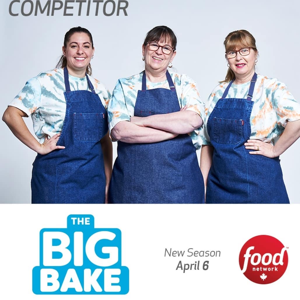 A promotional photo of Gisella, Beatriz and Teresa posing in blue aprons. The word competitiors is on the top. The bottom of the photo says The Big Bake, New Seaon April 6th, and Food Network.